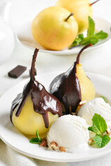 Poached pears with chocolate sauce and ice cream