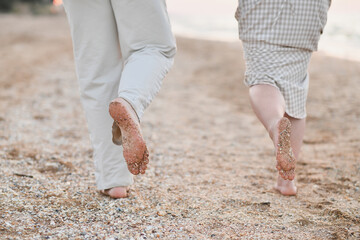 The sand on feet and heels on the coast