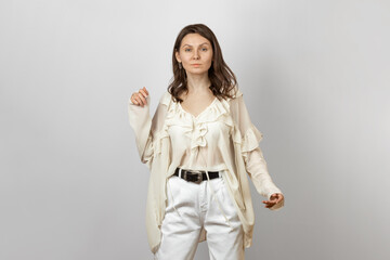 Woman Wearing White Jeans and Blouse with Frills