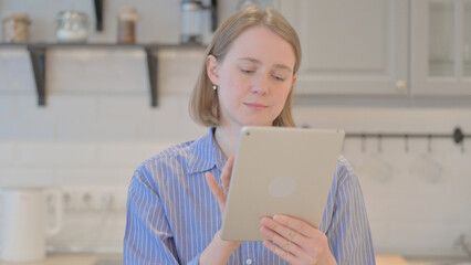 Portrait of Young Woman using Tablet Computer