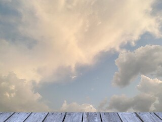 blue sky and clouds with wooden plank, copy space for your work or text.