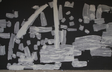 Repairing cracked walls by applying skim coat plaster to cover the cracks.