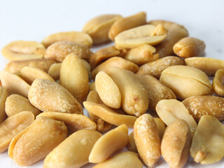 close up of peanuts isolated on white