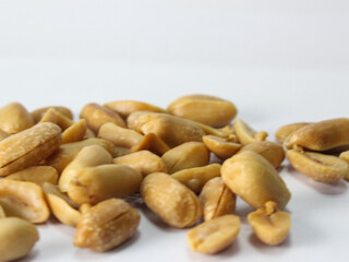 peeled peanut on white background, close up view