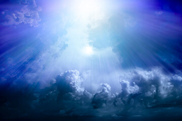 Obraz na płótnie Canvas Rays of light through a dramatic sky with clouds. Paradise.