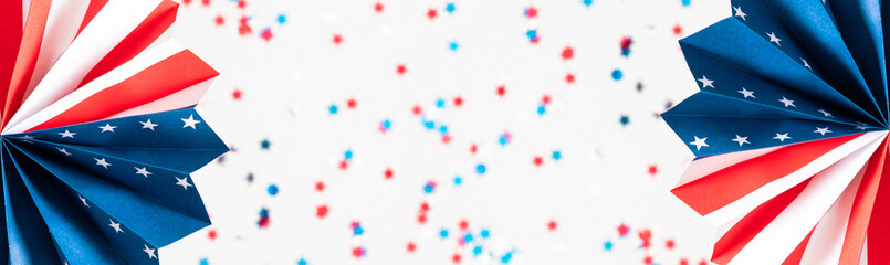 4th of July, USA Presidents Day, Independence Day, Memorial day, US election concept. Red white and blue paper fans with stars confetti on white background. Flat lay, top view, copy space, banner