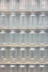 Picture of packed and foiled new empty jars, selective focus.