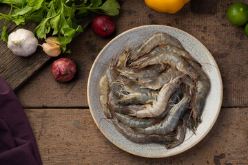 Close up Fresh raw shrimp (Litopenaeus vannamei) on grey plate.Top view.