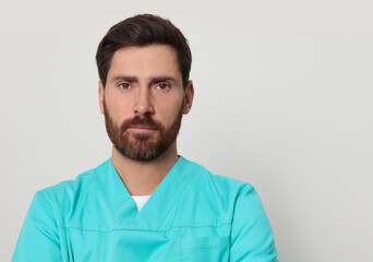 Fototapeta premium Nurse in medical uniform on white background