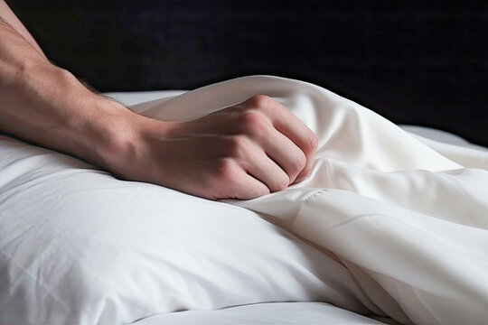 Male hand on soft bed pulling white sheets on bedroom hotel. Pleasure, erotic, ecstasy, orgasm, sex, intimacy and love and concept. Generative AI.