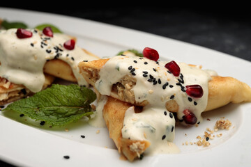 savoury chicken crepes with sour cream and sesame seeds