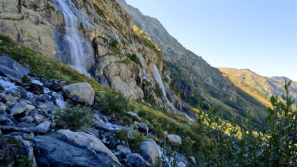 Fototapeta na wymiar beautiful mountain ridge highland fast water fall at summertime day - photo of nature