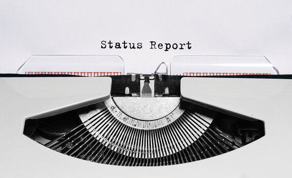 Text status report typed on retro typewriter