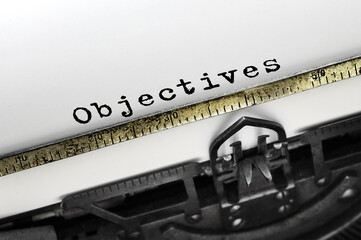 Text objectives typed on retro typewriter