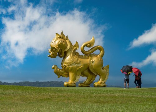 Singha statue at Singha Park. Tourists visiting the famous Singha statue. Northern Thailand's most beautiful travel destinations. Chiang rai. 