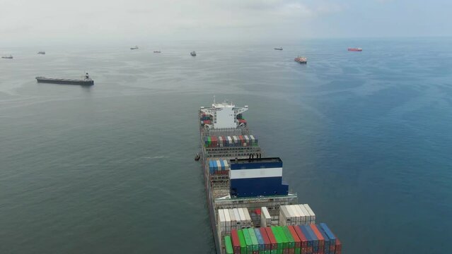 Callao, Lima, Peru -12.04.2022 Aerial view of ultra large container ship CMA CGM J.Adams in discharged condition at anchor near port Callao, Lima, Peru awaiting for enter to port with another ships