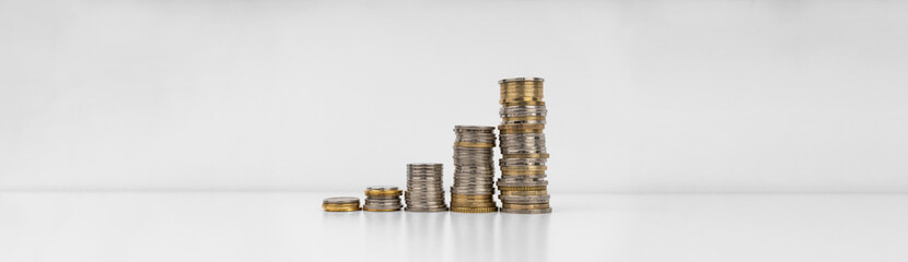 Stacks of coins on a white background