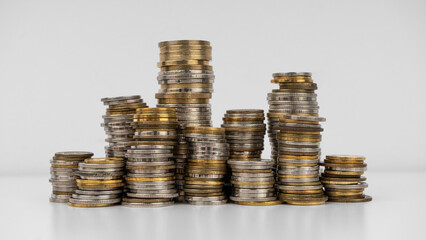 Stacks of coins on a white background