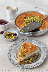 Traditional Arabian Kanafe with Cream and Cheese with pistachio nuts