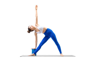 Yoga with props. Young caucasian woman does triangle pose using blue block, isolated on white.