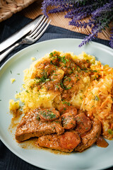 Stewed turkey meat with chorizo sausage.