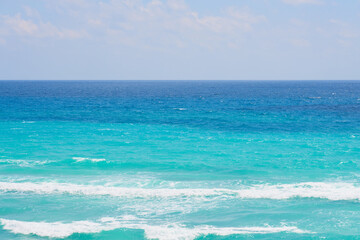 Waves of the caribbean sea with horizon on the background.