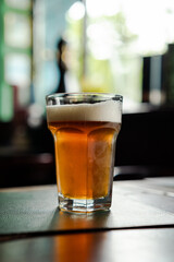 Pint of cold fresh beer in the bar