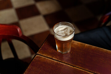 Top view of cold beer on wooden table in the bar