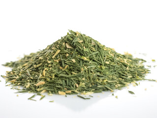 A pile of dried herbs sits on a white surface.