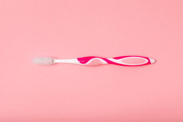 electric toothbrush, bamboo and handmade toothbrushes on a pink background with copy space. Flat lay. Oral hygiene. Oral care kit. Dentist concept. Place for text. Place to copy.