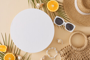 Beach relaxation concept. Top view flat lay of stylish handbag, sun-hat, shell bracelet, sunglasses, orange fruit and palm leaves on light beige background with blank circle for text or advert