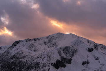 Dusk winter view of Y Garn mountain on Snowdonia's Glyderau ridge