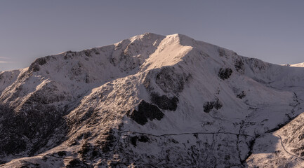 Aerial view of Y Garn mountain in Snowdonia under heavy snow