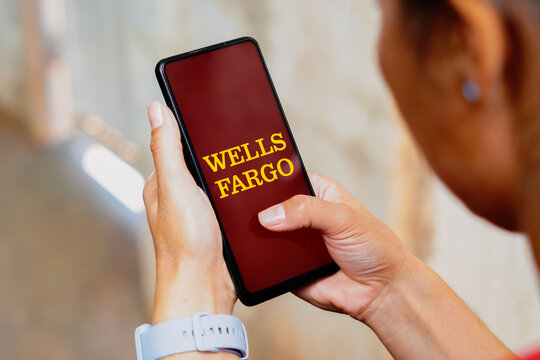 May 20, 2023, Brazil. In this photo illustration, the Wells Fargo logo is displayed on a smartphone screen.