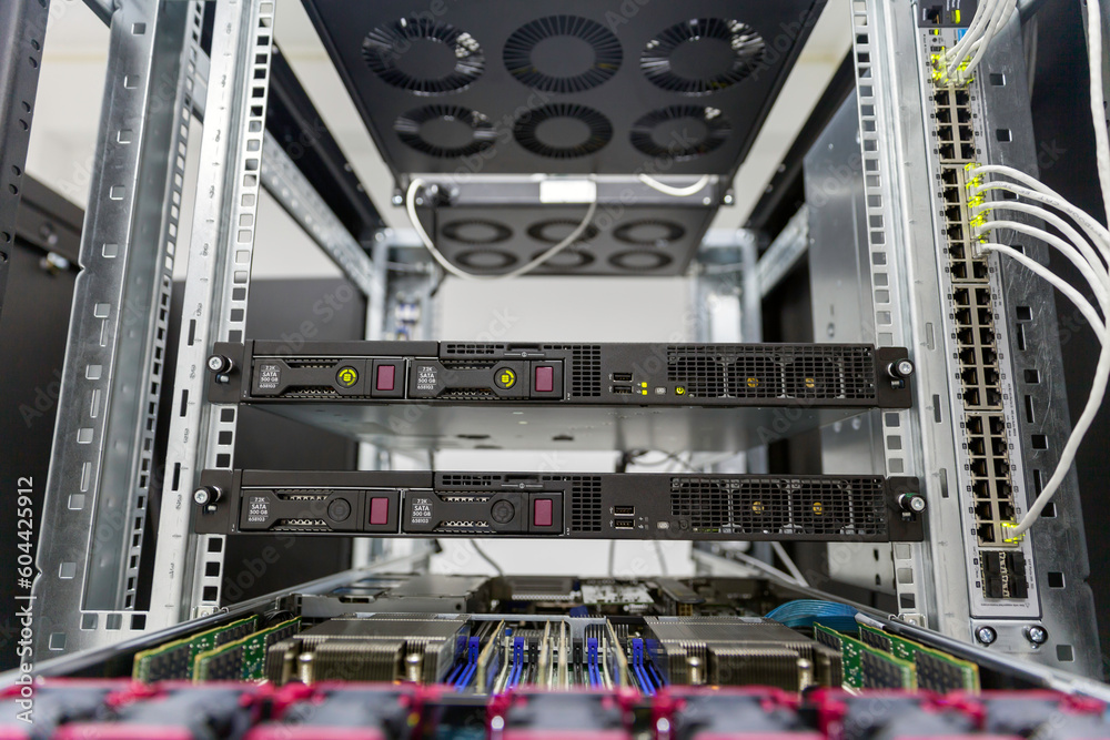Poster rackmount chassis with installed servers hardware in datacenter, front view from the control panel u