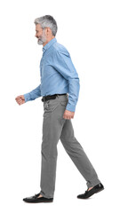 Fototapeta premium Mature businessman in stylish clothes posing on white background