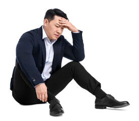 Tired businessman in suit sitting on white background