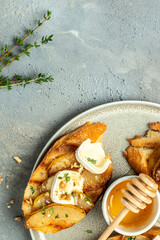 toasts croutons with cheese camembert and pear, honey, walnut, vertical image. top view. place for...