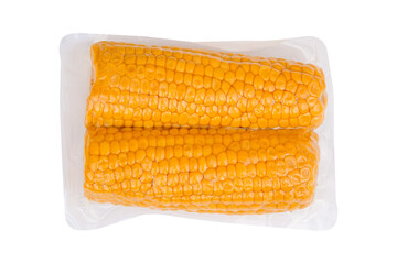 Ripe corn cob in a plastic bag isolated on white background - 604429562