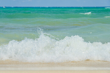 Waves of the caribbean sea with horizon on the background.