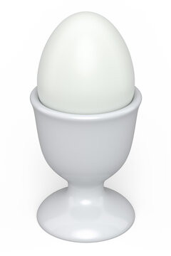 Farm boiled organic white sugar-coated eggs in ceramic egg cup for breakfast