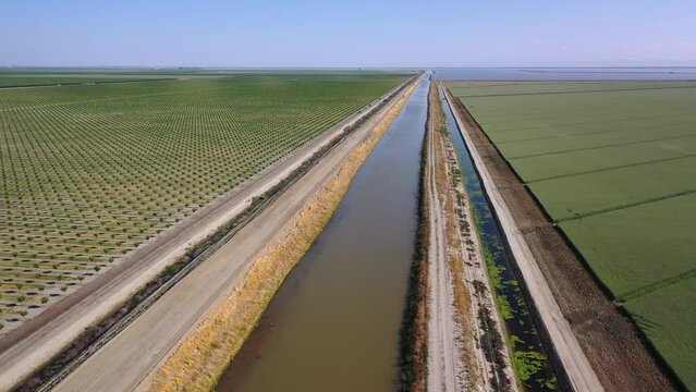 2023 - Excellent aerial view of cars driving alongside the Tulare Lake Cross Creek levee in Corcoran, California.