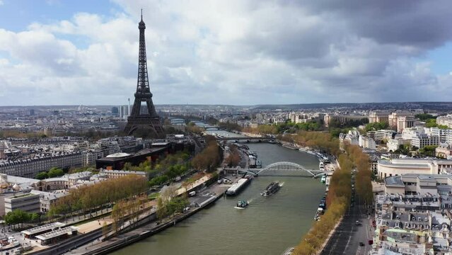 Aerial along Seine River and  Eiffel Tower in background.
City skyline panorama, France