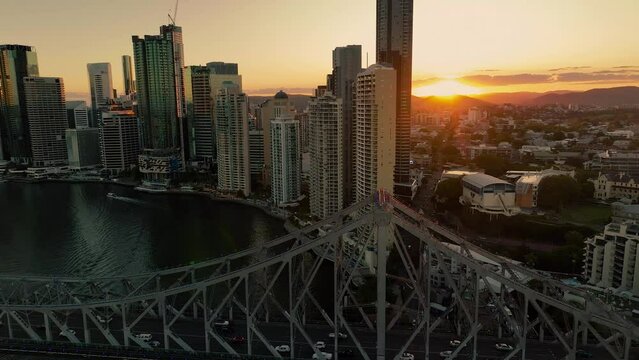 2023 - Excellent aerial footage circling a skyline in Brisbane, Australia at sunset.