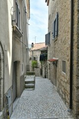 Fototapeta premium A narrow street of Macchia d'Isernia, a medieval village in the mountains of Molise., Italy.