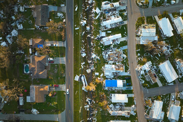 Destroyed by hurricane Ian suburban houses in Florida mobile home residential area. Consequences of...