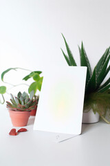 Blank white notecard on plant background, generative ai