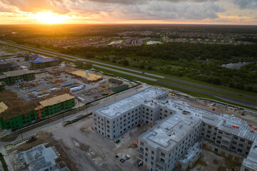 New apartment buildings under construction in american rural area. Development of residential housing in US suburbs. Real estate market in the USA