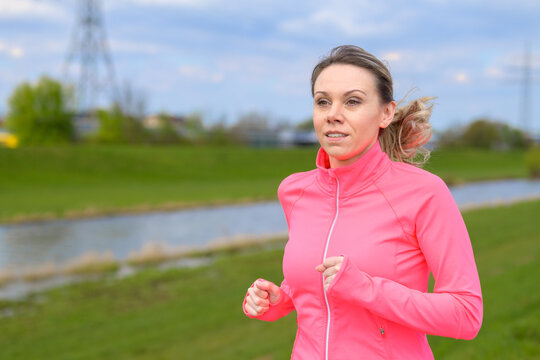Blonde woman jogging in the countryside
