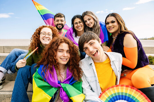 Diverse group of LGBT people having fun celebrating gay pride party festival day. LGBTQIA community concept